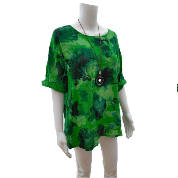 green abstract top with necklace