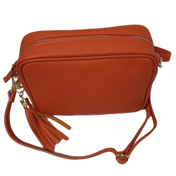 orange leather messenger bag showing top view and zipped fastening