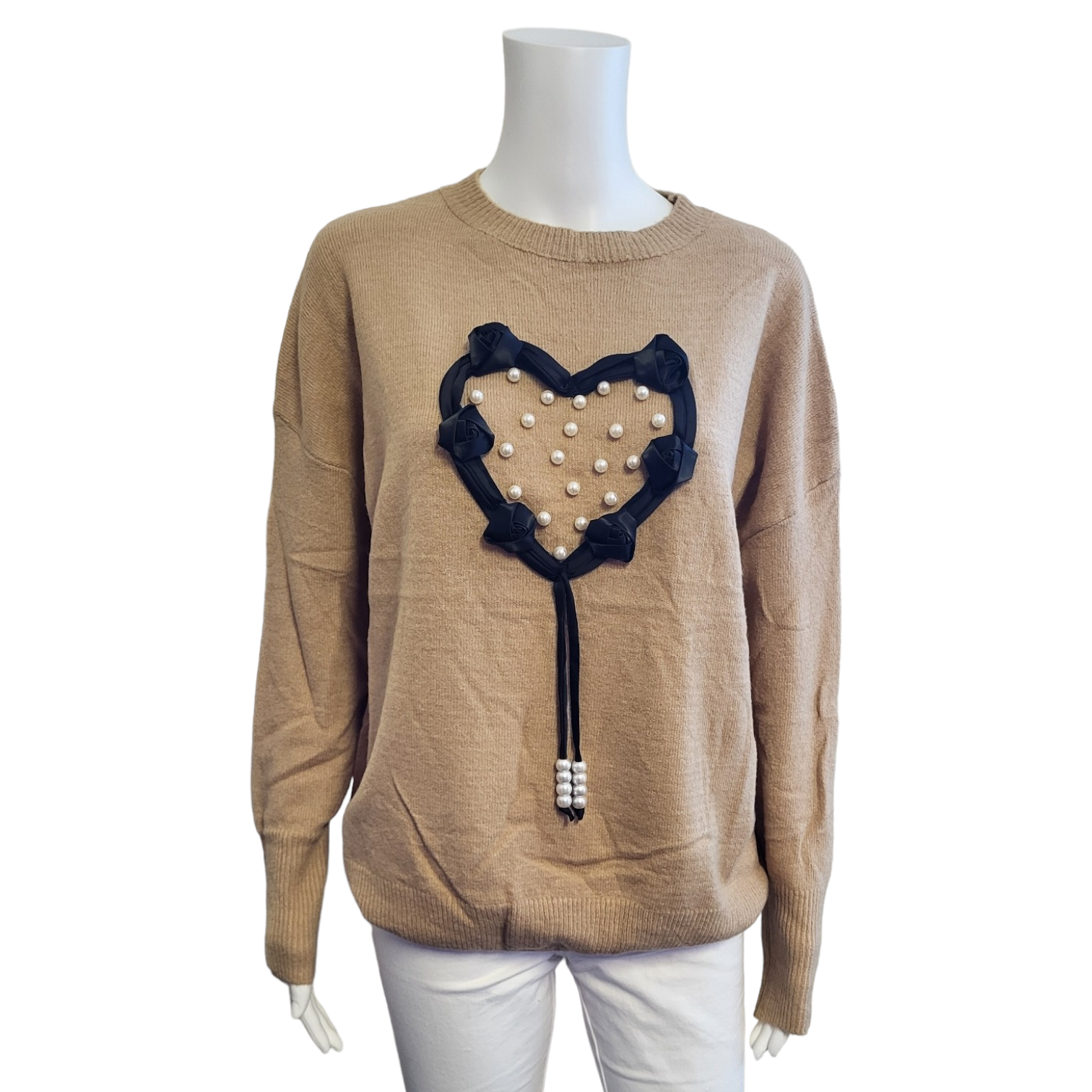 light brown jumper with large black ribbon heart and with pearl detail. long sleeves.