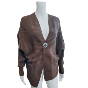brown ribbed cardigan fastened with magnetic star brooch (not included).