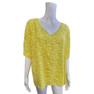 Yellow v necked top with small white flowers and short sleeves