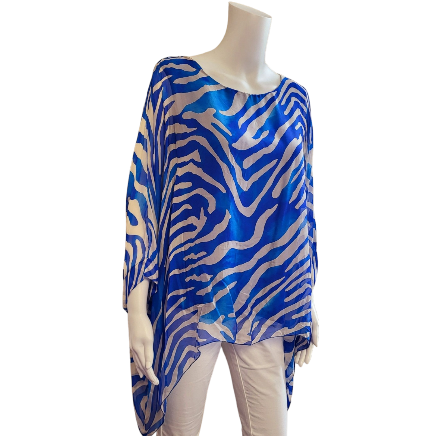 sap[hre blue zebra printed top with long sleeves and a scoop neck. longer dipped sides.