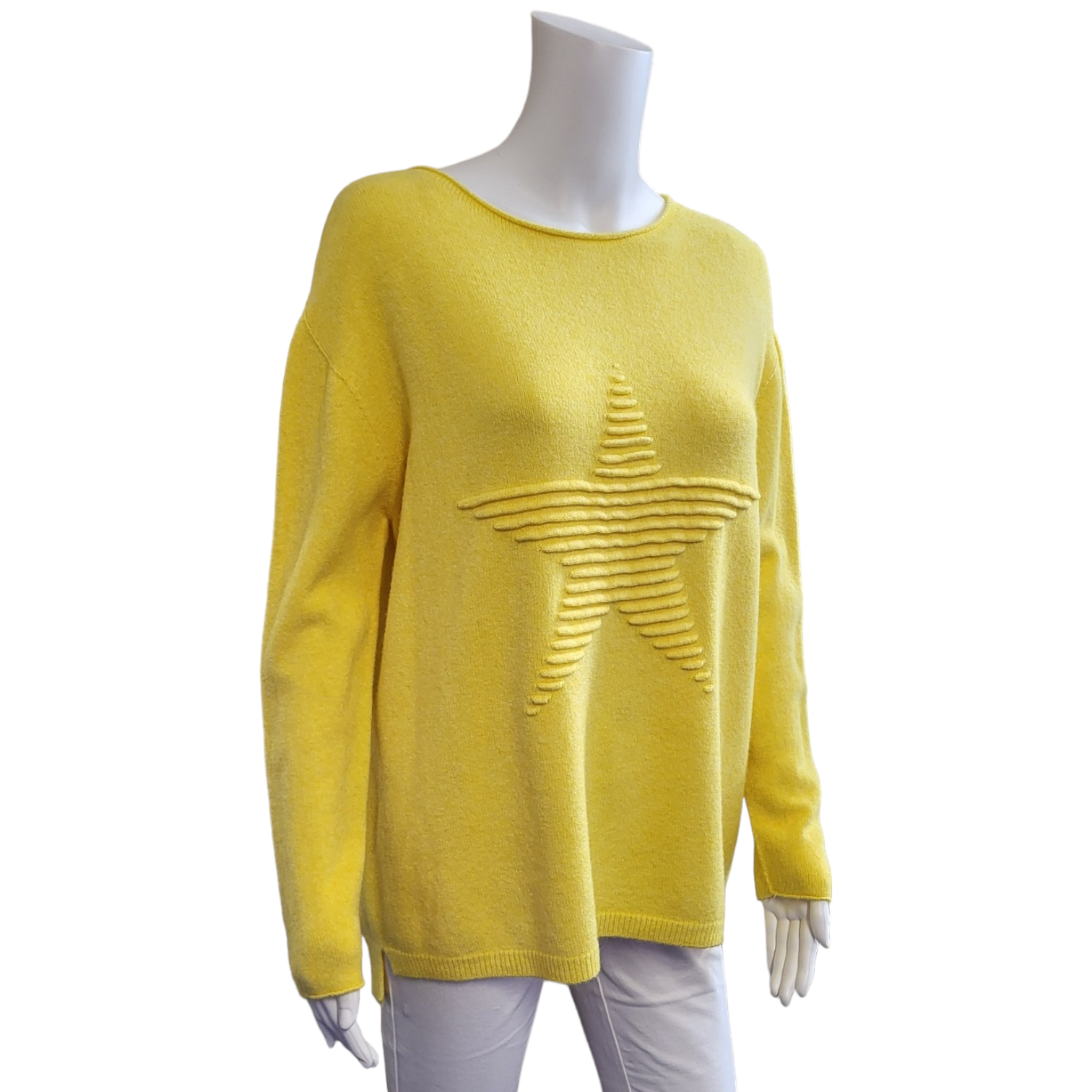 yellow jumper with long sleeves and large tetured star on the front