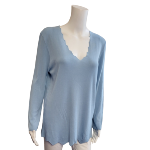 Pale blue top with long sleeves and scalloped v neckline