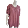 antique rose coloured top with short sleeves and v neck with embroidery detail