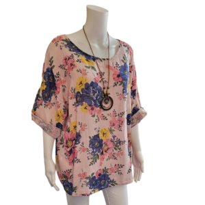 Pale pink top with large blue and yellow flowers, scoop neck and 3/4 sleeves