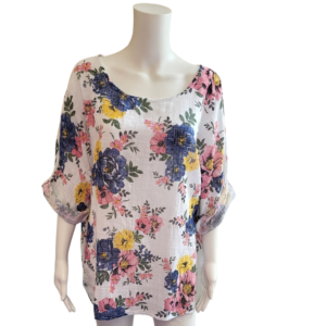 white top with large blue and yellow flower pattern, 3/4 sleeves and a scoop neck.