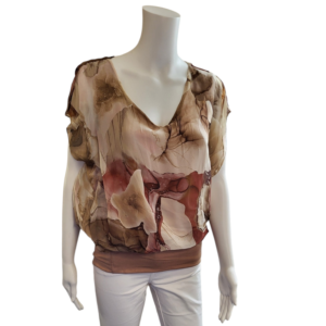 brown and beige abstract design on a silky top with v neck and short sleeves