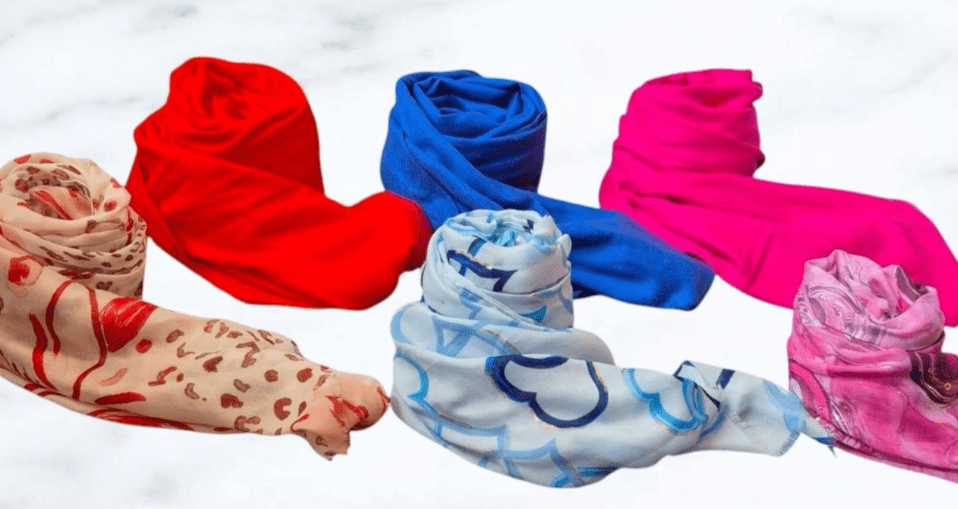 Six pairs of colorful socks displayed together, showcasing a variety of patterns and hues.